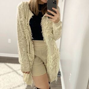 Fringe detail tan sweater with pockets